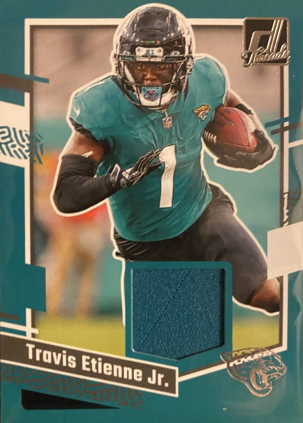 Travis Etienne 2023 Panini Donruss Threads Series Mint Insert Card #DTH-TEJ Featuring an Authentic Green Jersey Swatch
